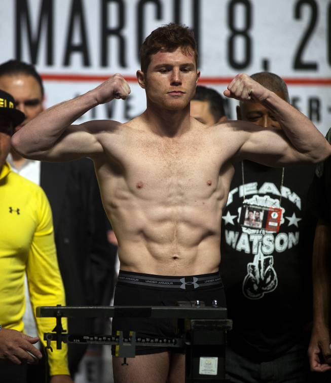 Super welterweight Canelo Alvarez of Mexico flexes during his weigh-in at the MGM Grand Arena on Friday, March 07, 2014.